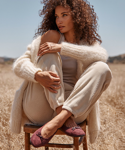 Woman sitting wearing Larissa Ballet Flat
